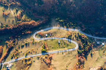 Curvy road in autumn forest.