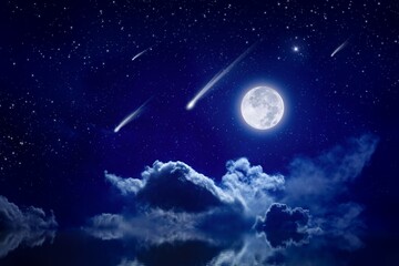 Obraz na płótnie Canvas Starry night sky with full moon rising above serene sea, shooting stars or comets in dark sky.