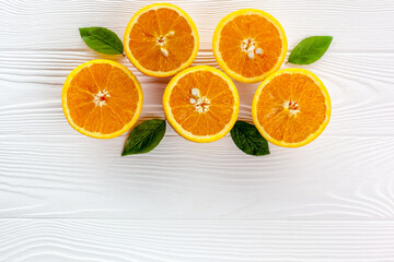 Orange slices on the on white table wooden background top view flat lay copy space