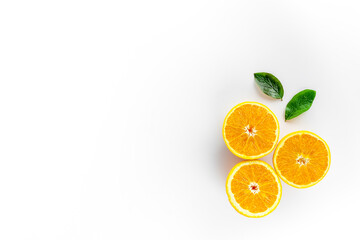 Orange slices on white background top view copy space