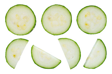 Zucchini slices isolated on white background, top view. Green fresh zucchini slices on white background. Slices of courgette isolated on white background, top view, close up. Set of pieces of zucchini