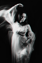 abstract portrait of a Ghost girl in a white dress on a dark background with blurred