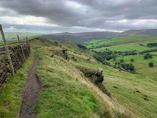 Countryside views from Mount Famine in the peak district, high peak, hayfield with dog hiking 