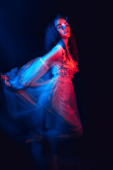 Obraz premium portrait of a brunette girl with mental disorders in a dress