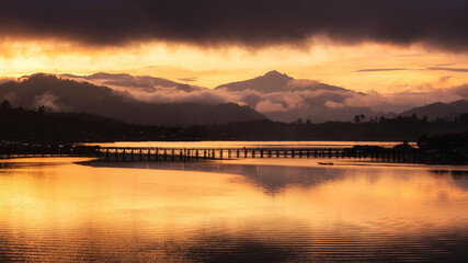 Mon bridge and boat at sunrise, Sangkhlaburi