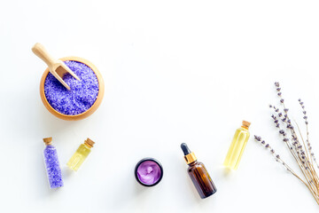 Fototapeta na wymiar Lavender spa set. Violet bath salt and essence oil on white background
