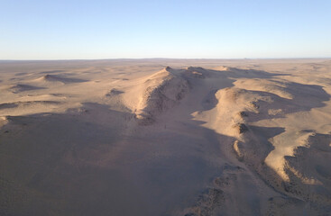 Fototapeta na wymiar Aerial over sand dunes in the desert