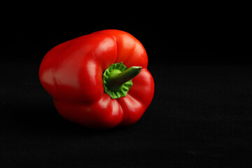 red bell pepper on black background