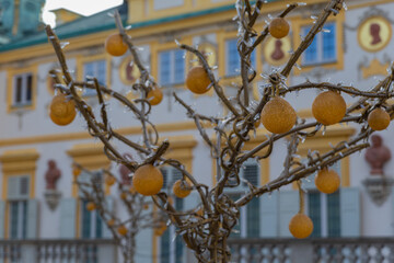 yellow glass balls on a metal tree