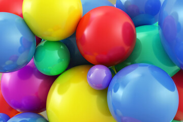 Obraz premium Multicolored shiny balls closeup on a light background.