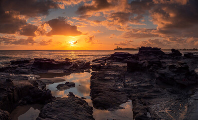 Beautiful Panoramic Golden Seaside Sunrise with Rockpool Reflections