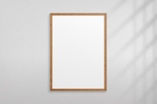Mockup wood frame photo on wall. Mock up wooden picture framed. Vertical boarder with shadow. Empty photoframe a4 isolated on background. Border for design prints poster and painting image. Vector