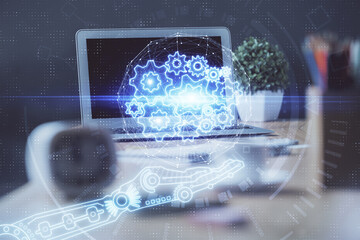 Double exposure of desktop computer and technology theme hologram. Concept of software development.