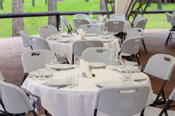 Banquet hall in the restaurant. Table served for festive dinner.