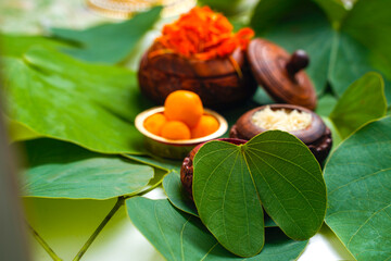 ,Indian festival dussehra , green leaf with rice and sweets