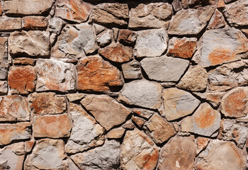Wall made of old rough cobblestone,