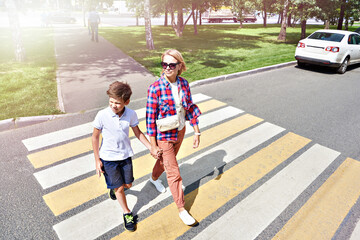 Woman and child on crosswalk street