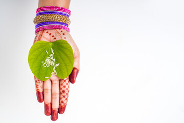 Indian festival Dussehra, green apta leaf in hand