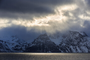 Dramatic clouds over snow-capped mountains of the Lyngen Alps, Lyngen Peninsula, Troms, Norway