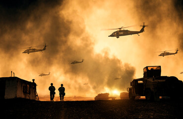 Military helicopters, forces and tanks between smoke in battle field at sunset © Meysam Azarneshin