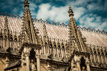 View of the exterior facade of the Roman Catholic Notre Dame de Reims Cathedral, a historical...