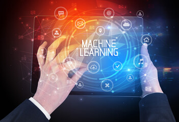 Close-up of a tablet with MACHINE LEARNING inscription, innovative technology concept