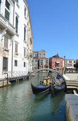 
glimpses of Venetian palaces with canals, bridges and typical gondolas