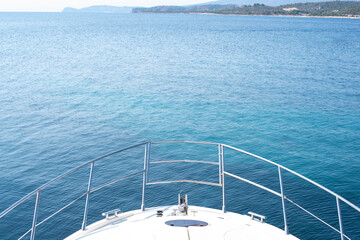 Fototapeta na wymiar Top view at yacht bow against blue sea.