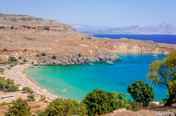 The beach and the gulf of Lindos. Crystal clear waters. Rhodes island, Greece.