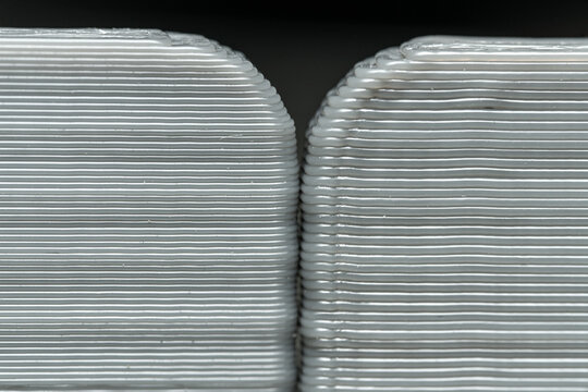 Multiple FDM 3D Printed Parts, one printed aat 0.2mm layer height the other printed with 0.3mm layer height.