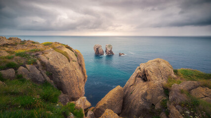 Cloudy sunrise on the coast of Liencres, Santander
