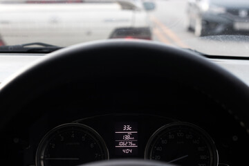 The car dashboard has a notification to see the car's system.