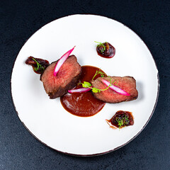 Medium Rare Filet mignon steak on white plate , selected focus