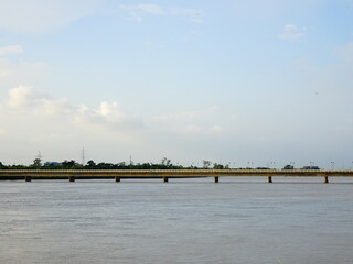 Old bridge standing on river filled with water in Bhubaneswar