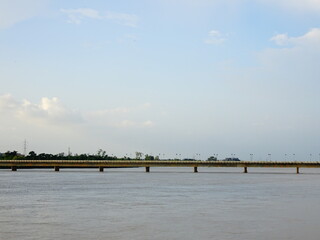 Old bridge standing on river filled with water in Bhubaneswar