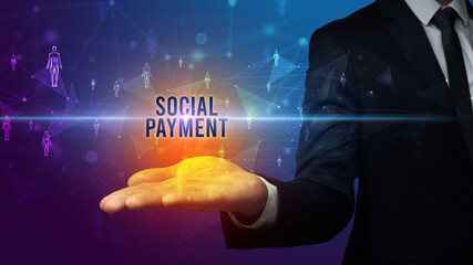 Elegant hand holding SOCIAL PAYMENT inscription, social networking concept