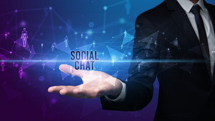 Elegant hand holding SOCIAL CHAT inscription, social networking concept