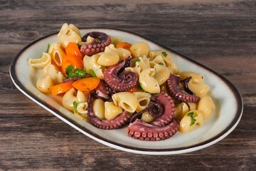 Pasta with octopus and yellow tomatoes