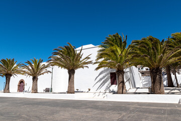 Fototapeta na wymiar churches and palm trees on the island of lanzarote canary islands,
