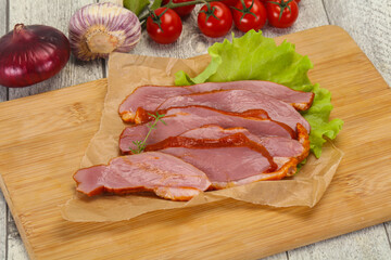 Sliced smoked duck breast served salad