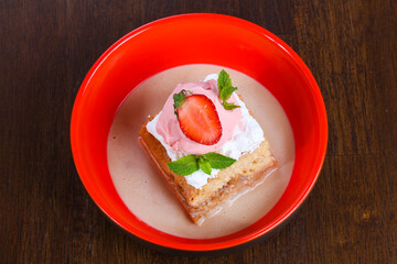 Cake with ice cream served stravberry