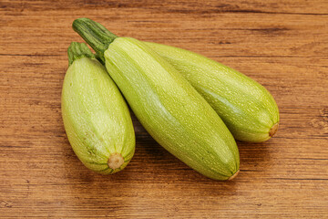 Young tasty zucchini over board