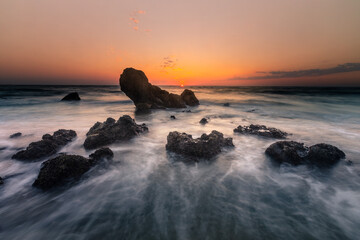 Look at the sunset from the beach of Ilbarritz's rocks at Biarritz, in the Basque Country.	