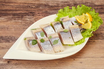 Herring fillet with sliced lemon