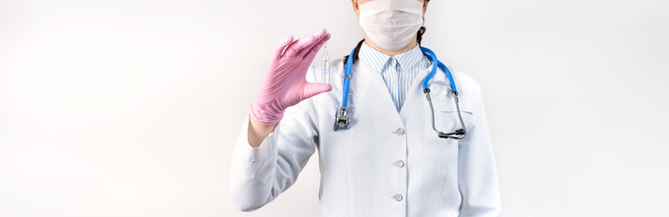 Cropped view of young female doctor holding ampoule vaccines for children or older adults