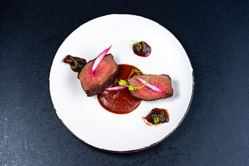 Medium Rare Filet mignon steak on white plate , selected focus