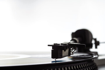 Fototapeta na wymiar The needle on a vinyl record. Equipment for reproducing analog sound recordings.