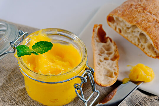 Ghee-clarified Butter Prepared From The Milk Of Cows. This Ghee Oil Is Used During Religious Ceremonies In India. Ayurveda. Butter Spread On Bread.