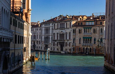 Venice, Veneto, Italy. Venetian canal with ancient palaces and bricole.