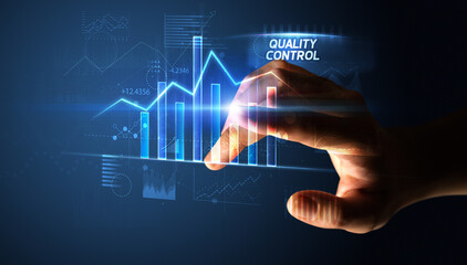 Hand touching QUALITY CONTROL button, business concept